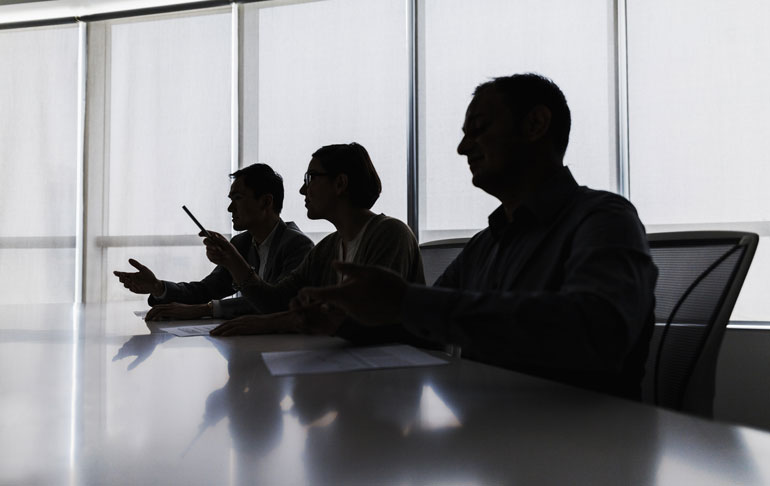 silhouette-of-business-people-in-meeting